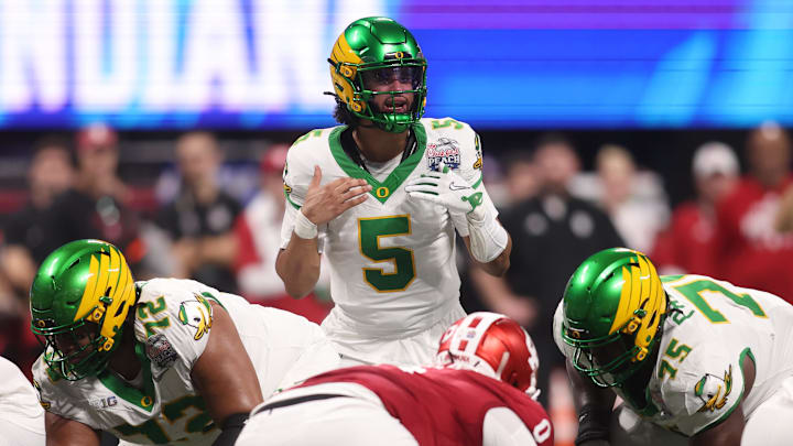 Jan 9, 2026; Atlanta, GA, USA; Oregon Ducks quarterback Dante Moore (5) calls a play on the line of scrimmage against the Indiana Hoosiers during the first quarter of the 2025 Peach Bowl and semifinal game of the College Football Playoff at Mercedes-Benz Stadium. Mandatory Credit: Brett Davis-Imagn Images