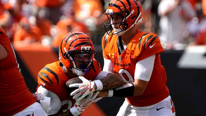 Cincinnati Bengals quarterback Joe Burrow (9) hands off to  running back Chase Brown (30) in the 4th quarter at Paycor Stadium on September 13, 2026. The Bengals beat the Tampa Bay Buccaneers 27-33.