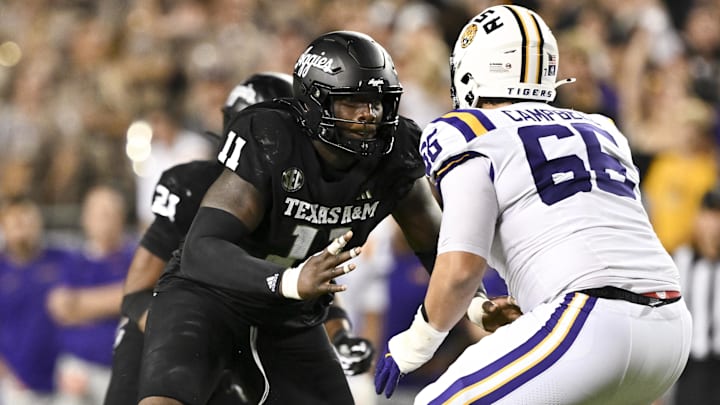 Oct 26, 2024; College Station, Texas, USA; Texas A&M Aggies defensive lineman Nic Scourton (11) defends in coverage against LSU Tigers offensive tackle Will Campbell (66) during the fourth quarter. The Aggies defeated the Tigers 38-23; at Kyle Field. Mandatory Credit: Maria Lysaker-Imagn Images. Oct 26, 2024; College Station, Texas, USA; Texas A&M Aggies defensive lineman Nic Scourton (11) defends in coverage against LSU Tigers offensive tackle Will Campbell (66) during the fourth quarter. The Aggies defeated the Tigers 38-23; at Kyle Field. Mandatory Credit: Maria Lysaker-Imagn Images.