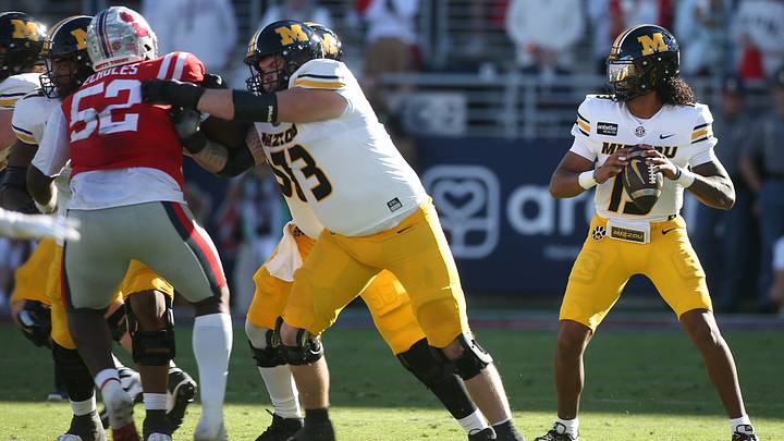 Oct 17, 2026; Oxford, Mississippi, USA;  Missouri Tigers quarterback Austin Simmons (13) drops back to pass during the first half against the Mississippi Rebels during the first half at Vaught-Hemingway Stadium.  Mandatory Credit: Petre Thomas-Imagn Images