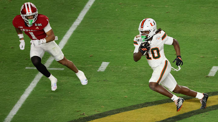 Miami Hurricanes wide receiver Malachi Toney (10) carries the ball defended by Indiana Hoosiers defensive back Amare Ferrell (1)