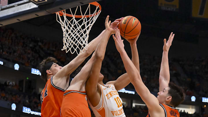 Dec 6, 2025; Nashville, Tennessee, USA; Illinois Fighting Illini center Zvonimir Ivisic (44), guard Andrej Stojakovic (2), and forward David Mirkovic (0) blocks the shot of Tennessee Volunteers forward Nate Ament (10) during the first half at Bridgestone Arena. Mandatory Credit: Steve Roberts-Imagn Images Dec 6, 2025; Nashville, Tennessee, USA; Illinois Fighting Illini center Zvonimir Ivisic (44), guard Andrej Stojakovic (2), and forward David Mirkovic (0) blocks the shot of Tennessee Volunteers forward Nate Ament (10) during the first half at Bridgestone Arena. Mandatory Credit: Steve Roberts-Imagn Images
