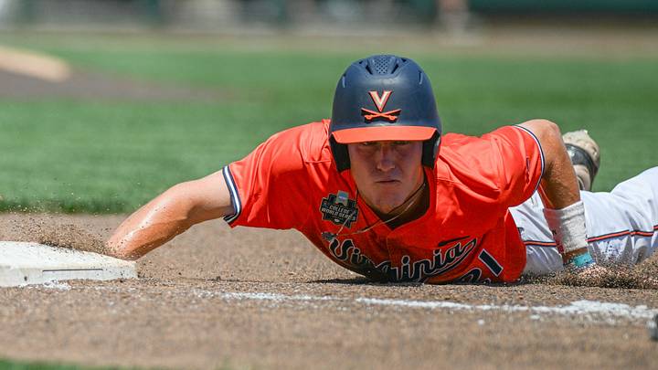 Jun 14, 2024; Omaha, NE, USA; Virginia Cavaliers third baseman Eric Becker (21) slides back into first base against the North Carolina Tar Heels during the fourth inning at Charles Schwab Filed Omaha. Mandatory Credit: Steven Branscombe-USA TODAY Sports Jun 14, 2024; Omaha, NE, USA; Virginia Cavaliers third baseman Eric Becker (21) slides back into first base against the North Carolina Tar Heels during the fourth inning at Charles Schwab Filed Omaha. Mandatory Credit: Steven Branscombe-USA TODAY Sports