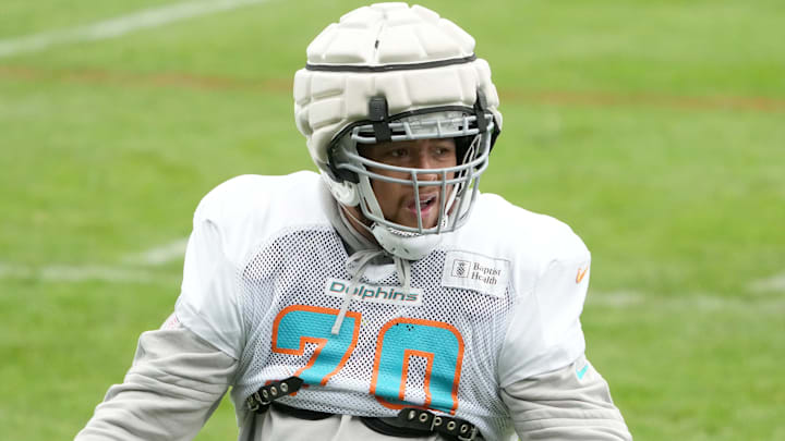 Miami Dolphins offensive tackle Kendall Lamm (70) wears a Guardian helmet cap during practice at the PSD Bank Arena in Germany in 2023. Miami Dolphins offensive tackle Kendall Lamm (70) wears a Guardian helmet cap during practice at the PSD Bank Arena in Germany in 2023.