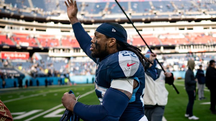 Tennessee Titans running back Derrick Henry (22) waves to fans as he exits the field after defeating
