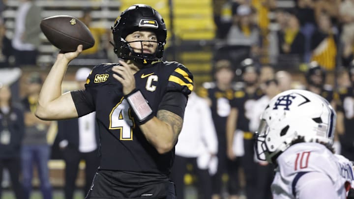 Sep 19, 2024; Boone, North Carolina, USA;  Appalachian State Mountaineers quarterback Joey Aguilar (4) throws a pass over South Alabama Jaguars linebacker Aakil Washington (10) during the second half at Kidd Brewer Stadium. Mandatory Credit: Reinhold Matay-Imagn Images