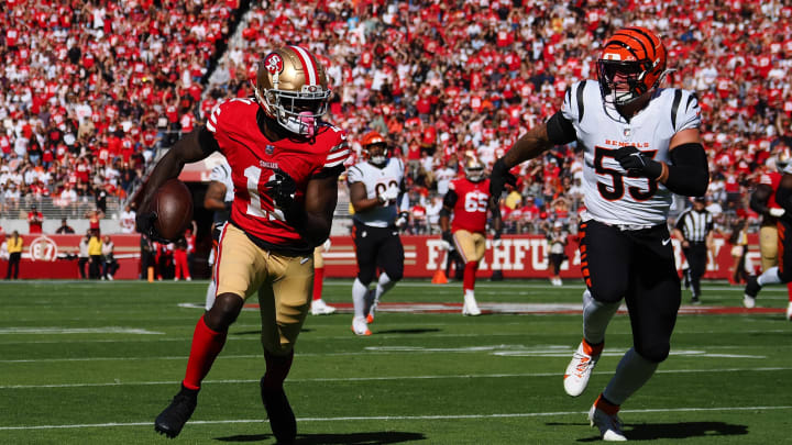 Oct 29, 2023; Santa Clara, California, USA; San Francisco 49ers wide receiver Brandon Aiyuk (11) carries the ball against Cincinnati Bengals linebacker Logan Wilson (55) during the first quarter at Levi's Stadium. Mandatory Credit: Kelley L Cox-USA TODAY Sports