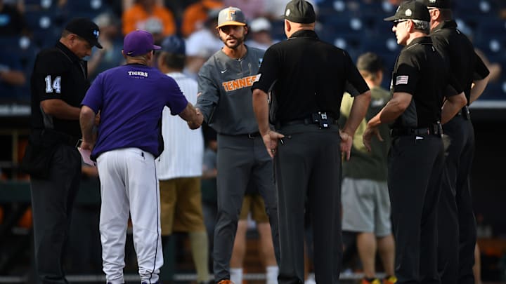Tennessee head coach Tony Vitello shakes hands with LSU head coach Jay Johnson before the start of a NCAA College World Series elimination game between Tennessee and LSU at Charles Schwab Field in Omaha, Neb. on Tuesday, June 20, 2023.