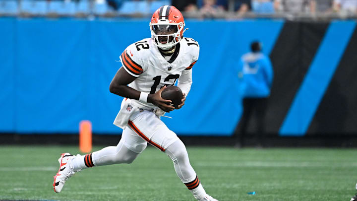 Aug 8, 2025; Charlotte, North Carolina, USA; Cleveland Browns quarterback Shedeur Sanders (12) with the ball in the first quarter at Bank of America Stadium. Mandatory Credit: Bob Donnan-Imagn Images