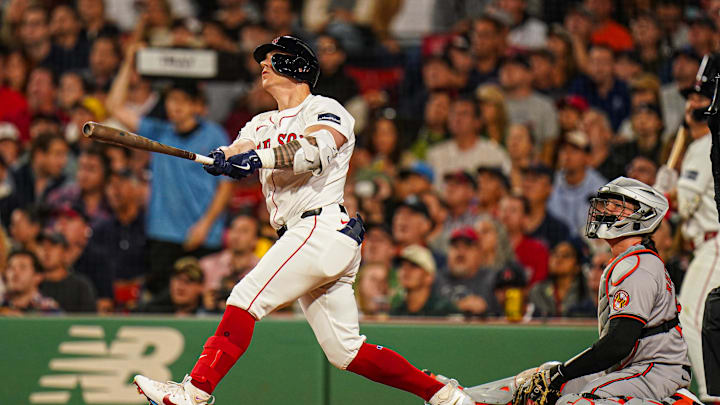 Sep 9, 2024; Boston, Massachusetts, USA; Boston Red Sox designated hitter Tyler O'Neill (17) hits a home run against the Baltimore Orioles in the third inning at Fenway Park. Mandatory Credit: David Butler II-Imagn Images