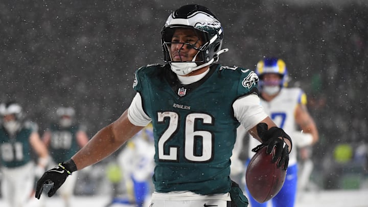 Jan 19, 2025; Philadelphia, Pennsylvania, USA; Philadelphia Eagles running back Saquon Barkley (26) celebrates after scoring a touchdown against the Los Angeles Rams in the second half in a 2025 NFC divisional round game at Lincoln Financial Field.