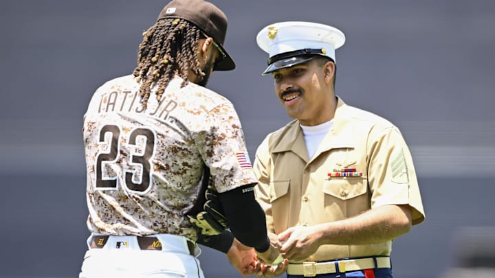 Padres outfielder Fernando Tatis Jr. (23) signs a ball for a U.S. Marine at Petco Park on June 22.
