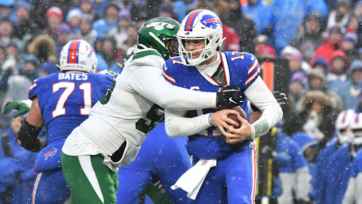 Dec 11, 2022; Orchard Park, New York, USA; Buffalo Bills quarterback Josh Allen (17) is sacked by