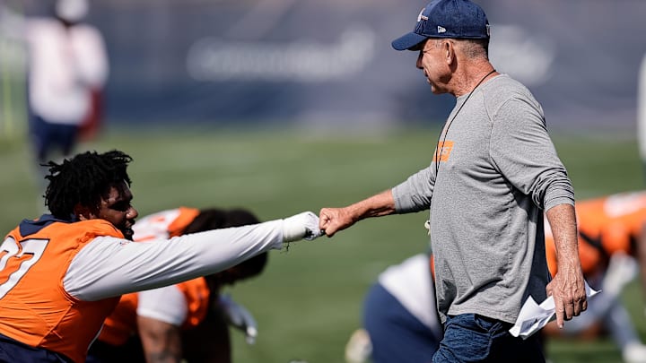 Jul 23, 2025; Englewood, CO, USA; Denver Broncos head coach Sean Payton and defensive tackle Malcolm Roach (97) during Denver Broncos Training Camp. Mandatory Credit: Isaiah J. Downing-Imagn Images Jul 23, 2025; Englewood, CO, USA; Denver Broncos head coach Sean Payton and defensive tackle Malcolm Roach (97) during Denver Broncos Training Camp. Mandatory Credit: Isaiah J. Downing-Imagn Images