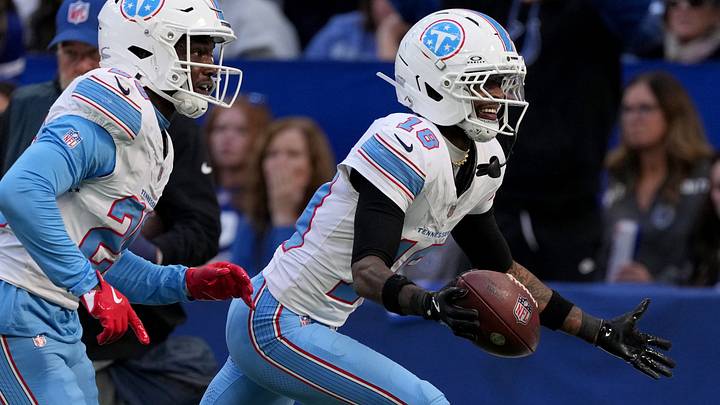 Tennessee Titans cornerback Cor'dale Flott (18) intercepts Indianapolis Colts quarterback Daniel Jones (17) on Sunday, Oct. 18, 2026, at Lucas Oil Stadium in Indianapolis. Tennessee Titans cornerback Cor'dale Flott (18) intercepts Indianapolis Colts quarterback Daniel Jones (17) on Sunday, Oct. 18, 2026, at Lucas Oil Stadium in Indianapolis.