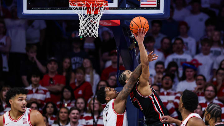 Arizona Wildcats guard Caleb Love (1) attempts to block a shot made by Houston Cougars guard Milos Uzan (7) during the second half at McKale Center. Arizona Wildcats guard Caleb Love (1) attempts to block a shot made by Houston Cougars guard Milos Uzan (7) during the second half at McKale Center.