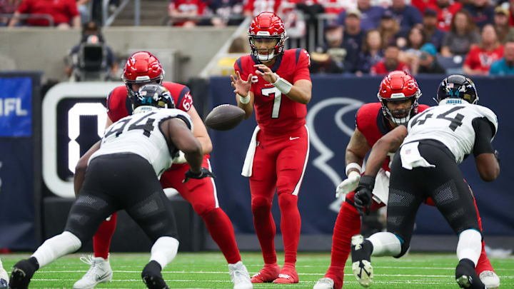Nov 26, 2023; Houston, Texas, USA;  The ball is hiked to Houston Texans quarterback C.J. Stroud (7) against the Jacksonville Jaguars at NRG Stadium. Mandatory Credit: Thomas Shea-Imagn Images