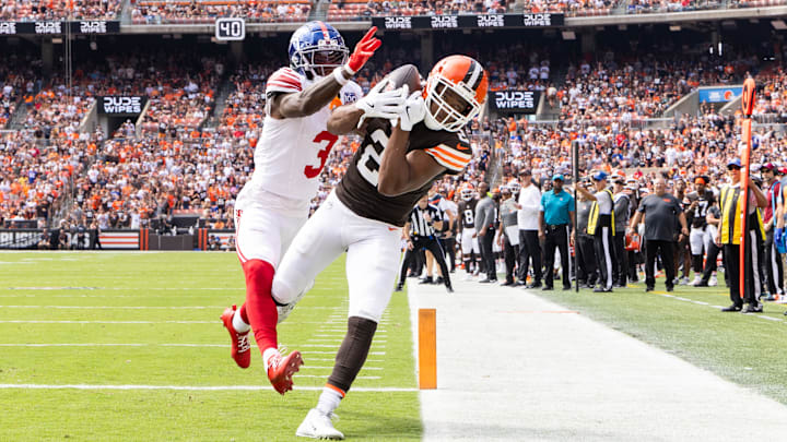 Sep 22, 2024; Cleveland, Ohio, USA; Cleveland Browns wide receiver Amari Cooper (2) makes a touchdown reception under coverage by New York Giants cornerback Deonte Banks (3) during the first quarter at Huntington Bank Field.  
