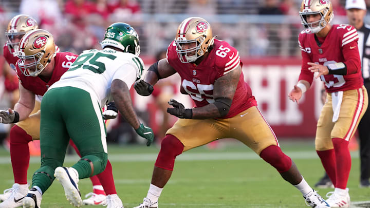 Sep 9, 2024; Santa Clara, California, USA; San Francisco 49ers guard Aaron Banks (65) blocks New York Jets defensive tackle Quinnen Williams (center left) during the second quarter at Levi's Stadium. Mandatory Credit: Darren Yamashita-Imagn Images