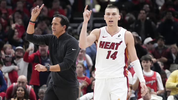 Apr 16, 2025; Chicago, Illinois, USA; Miami Heat guard Tyler Herro (14) and head coach Erik Spoelstra ask for a replay against the Chicago Bulls during the second half at United Center. Mandatory Credit: David Banks-Imagn Images
