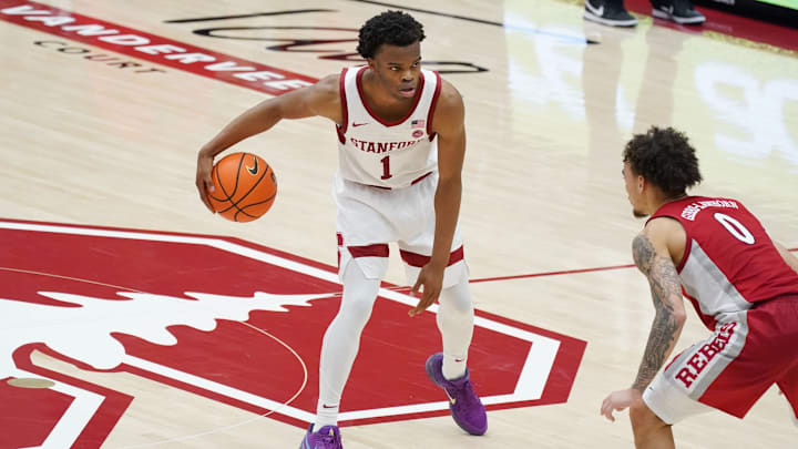 Dec 7, 2025; Stanford, California, USA;  Stanford Cardinal guard Ebuka Okorie (1) dribbles upcourt against UNLV Runnin' Rebels guard Dra Gibbs-Lawhorn (0) in the second half at Maples Pavilion. Mandatory Credit: David Gonzales-Imagn Images