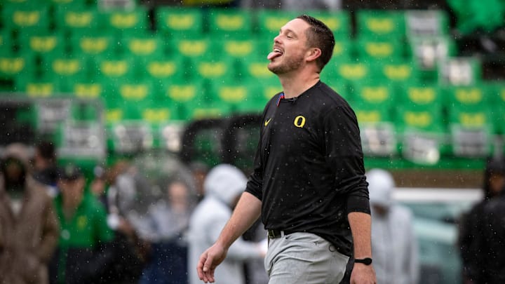 Oregon head coach Dan Lanning sticks his tongue out to catch the rain as the No. 6 Oregon Ducks host California Saturday, Nov. 4, 2023, at Autzen Stadium in Eugene, Ore.