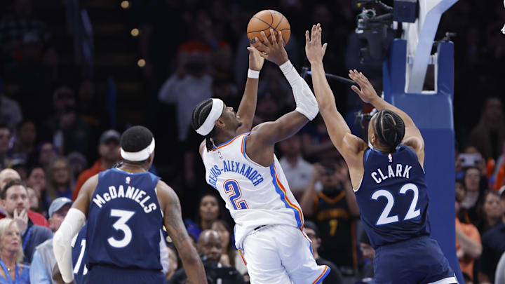 Feb 24, 2025; Oklahoma City, Oklahoma, USA; Oklahoma City Thunder guard Shai Gilgeous-Alexander (2) shoots as Minnesota Timberwolves guard Jaylen Clark (22) defends during the second half at Paycom Center. Mandatory Credit: Alonzo Adams-Imagn Images