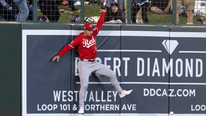 Mar 4, 2025; Phoenix, Arizona, USA; Cincinnati Reds left fielder Stuart Fairchild is unable to make a leaping catch at the wall against the Los Angeles Dodgers during a spring training game at Camelback Ranch-Glendale. Mandatory Credit: Mark J. Rebilas-Imagn Images