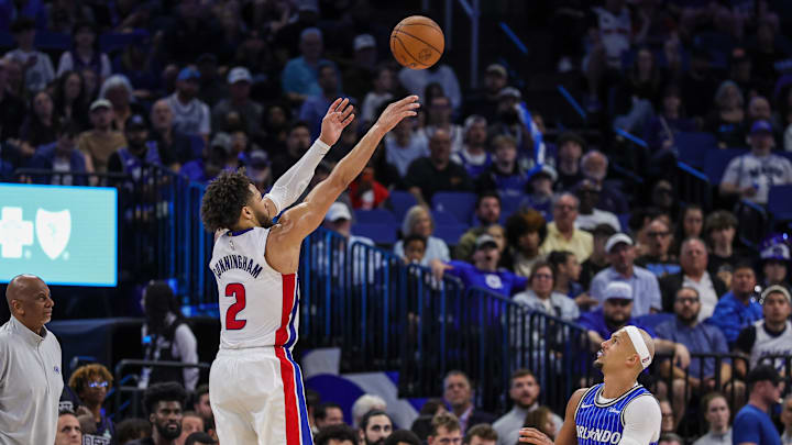 Mar 1, 2026; Orlando, Florida, USA; Detroit Pistons guard Cade Cunningham (2) shoots a three-point basket over Orlando Magic guard Jalen Suggs (4) during the second half at Kia Center. Mandatory Credit: Mike Watters-Imagn Images Mar 1, 2026; Orlando, Florida, USA; Detroit Pistons guard Cade Cunningham (2) shoots a three-point basket over Orlando Magic guard Jalen Suggs (4) during the second half at Kia Center. Mandatory Credit: Mike Watters-Imagn Images