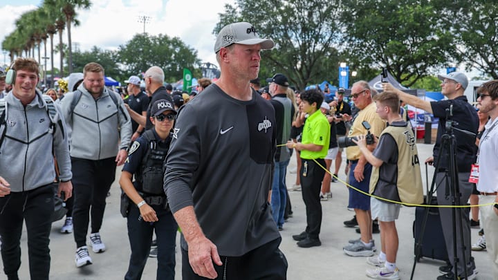 Sep 20, 2025; Orlando, Florida, USA; UCF Knights head coach Scott Frost walks into the venue before the game against the North Carolina Tar Heels at the Bounce House Stadium. Mandatory Credit: Mike Watters-Imagn Images Sep 20, 2025; Orlando, Florida, USA; UCF Knights head coach Scott Frost walks into the venue before the game against the North Carolina Tar Heels at the Bounce House Stadium. Mandatory Credit: Mike Watters-Imagn Images