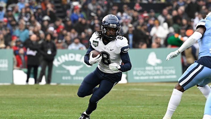 Dec 28, 2024; Boston, MA, USA; Connecticut Huskies wide receiver TJ Sheffield (8) runs the ball against the North Carolina Tar Heels during the first half at Fenway Park. Mandatory Credit: Eric Canha-Imagn Images Dec 28, 2024; Boston, MA, USA; Connecticut Huskies wide receiver TJ Sheffield (8) runs the ball against the North Carolina Tar Heels during the first half at Fenway Park. Mandatory Credit: Eric Canha-Imagn Images