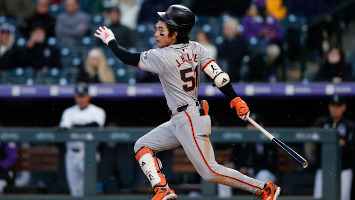 May 7, 2024; Denver, Colorado, USA; San Francisco Giants center fielder Jung Hoo Lee (51) hits a single in the fourth inning against the Colorado Rockies at Coors Field. 