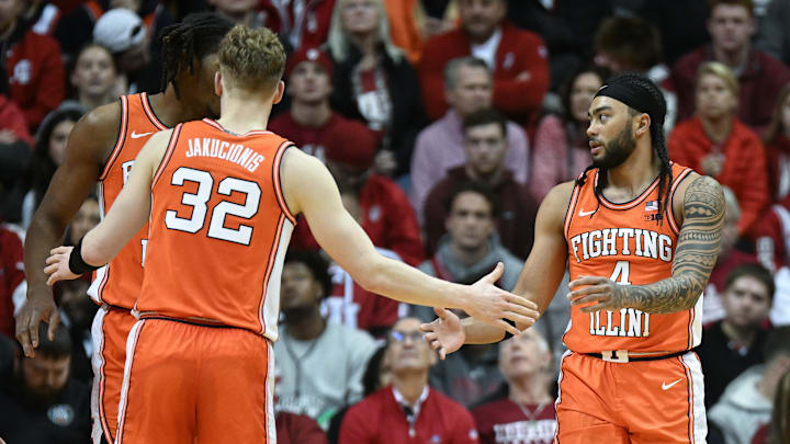 Jan 14, 2025; Bloomington, Indiana, USA; Illinois Fighting Illini guard Kasparas Jakucionis (32) high-fives Illinois Fighting Illini guard Kylan Boswell (4) during the first half against the Indiana Hoosiers at Simon Skjodt Assembly Hall. Mandatory Credit: Robert Goddin-Imagn Images