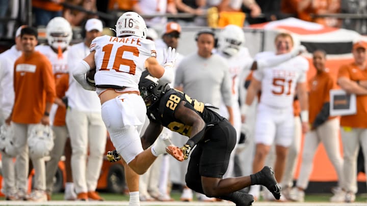 Oct 26, 2024; Nashville, Tennessee, USA;  Vanderbilt Commodores running back Sedrick Alexander (28) tackles Texas Longhorns defensive back Michael Taaffe (16) after the interception during the first half at FirstBank Stadium. Mandatory Credit: Steve Roberts-Imagn Images