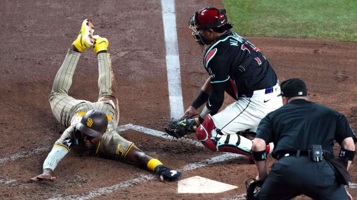May 4, 2024; Phoenix, Arizona, USA; San Diego Padres outfielder Jurickson Profar (10) slides safely into home