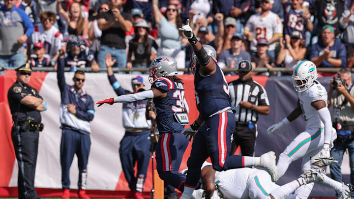 New England Patriots running back Rhamondre Stevenson (38) scores a touchdown during the first half against the Miami Dolphins at Gillette Stadium.