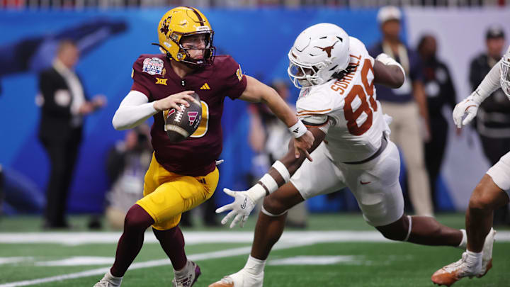 Jan 1, 2025; Atlanta, GA, USA; Arizona State Sun Devils quarterback Sam Leavitt (10) looks to pass the ball against Texas Longhorns linebacker Barryn Sorrell (88) during the first half of the Peach Bowl at Mercedes-Benz Stadium. Mandatory Credit: Brett Davis-Imagn Images