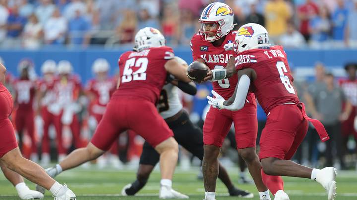 Kansas Jayhawks quarterback Isaiah Marshall (8) hands the ball to Kansas Jayhawks running back Yasin Willis (6) during the game inside David Booth Kansas Memorial Stadium on Sept. 11, 2026. Kansas Jayhawks quarterback Isaiah Marshall (8) hands the ball to Kansas Jayhawks running back Yasin Willis (6) during the game inside David Booth Kansas Memorial Stadium on Sept. 11, 2026.