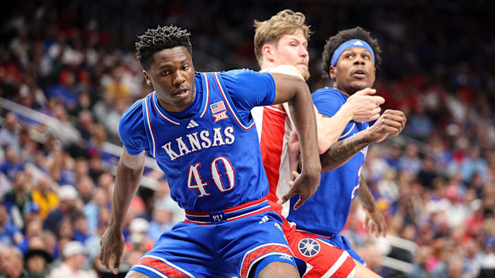 Mar 13, 2025; Kansas City, MO, USA; Kansas Jayhawks forward Flory Bidunga (40) battles for position during the first half against the Arizona Wildcats at T-Mobile Center. Mandatory Credit: William Purnell-Imagn Images Mar 13, 2025; Kansas City, MO, USA; Kansas Jayhawks forward Flory Bidunga (40) battles for position during the first half against the Arizona Wildcats at T-Mobile Center. Mandatory Credit: William Purnell-Imagn Images