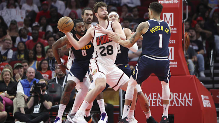 Mar 23, 2025; Houston, Texas, USA; Houston Rockets center Alperen Sengun (28) looks to pass the ball during the fourth quarter against the Denver Nuggets at Toyota Center. Mandatory Credit: Troy Taormina-Imagn Images Mar 23, 2025; Houston, Texas, USA; Houston Rockets center Alperen Sengun (28) looks to pass the ball during the fourth quarter against the Denver Nuggets at Toyota Center. Mandatory Credit: Troy Taormina-Imagn Images