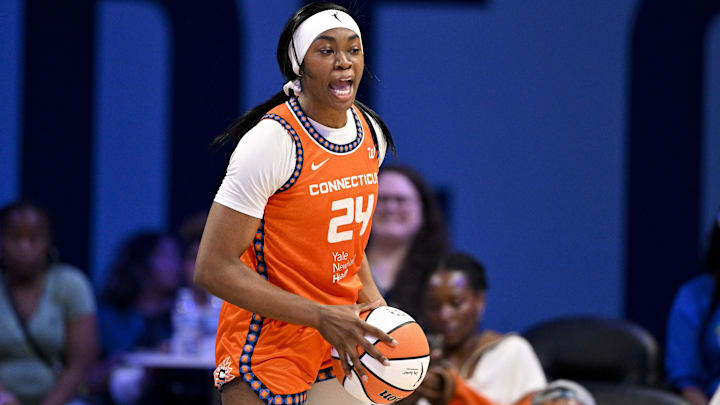 Aug 27, 2025; Arlington, Texas, USA; Connecticut Sun forward Aneesah Morrow (24) grabs a rebound against the Dallas Wings during the second half at College Park Center. 