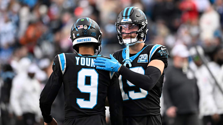 Nov 24, 2024; Charlotte, North Carolina, USA; Carolina Panthers quarterback Bryce Young (9) with wide receiver Adam Thielen (19) on the field in the fourth quarter at Bank of America Stadium. Mandatory Credit: Bob Donnan-Imagn Images