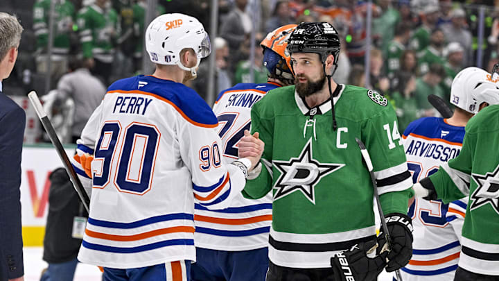 May 29, 2025; Dallas, Texas, USA; Edmonton Oilers right wing Corey Perry (90) and Dallas Stars left wing Jamie Benn (14) shake hands after the game between the Dallas Stars and the Edmonton Oilers in game five of the Western Conference Final of the 2025 Stanley Cup Playoffs at American Airlines Center. Mandatory Credit: Jerome Miron-Imagn Images
