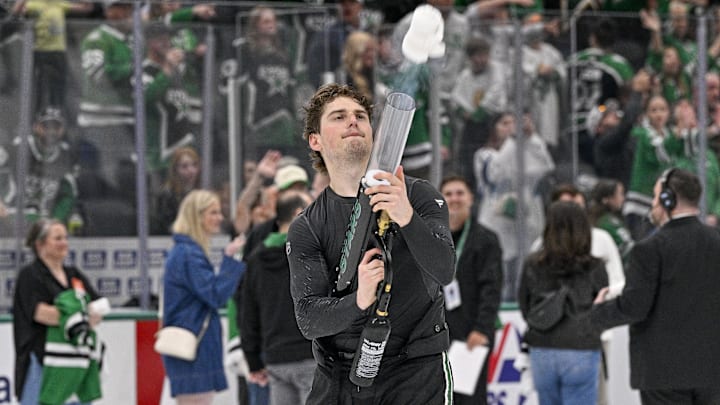 Apr 11, 2026; Dallas, Texas, USA; Dallas Stars center Justin Hryckowian (49) uses a t-shirt cannon after the Stars defeat the New York Rangers at the American Airlines Center. Mandatory Credit: Jerome Miron-Imagn Images