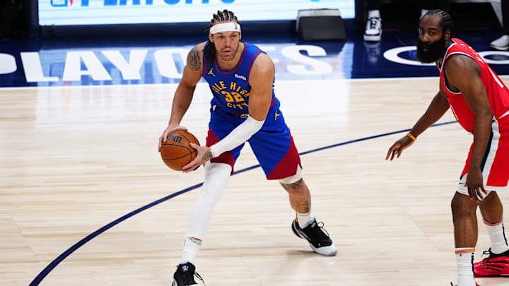 Apr 19, 2025; Denver, Colorado, USA; LA Clippers guard James Harden (1) defends on Denver Nuggets forward Aaron Gordon (32) in the first quarter at Ball Arena. Mandatory Credit: Ron Chenoy-Imagn Images