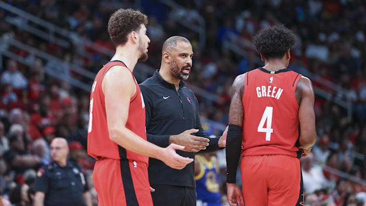 Oct 29, 2023; Houston, Texas, USA; Houston Rockets head coach Ime Udoka talks with center Alperen Sengun (28) and guard Jalen Green (4) during the game against the Golden State Warriors at Toyota Center. Mandatory Credit: Troy Taormina-Imagn Images