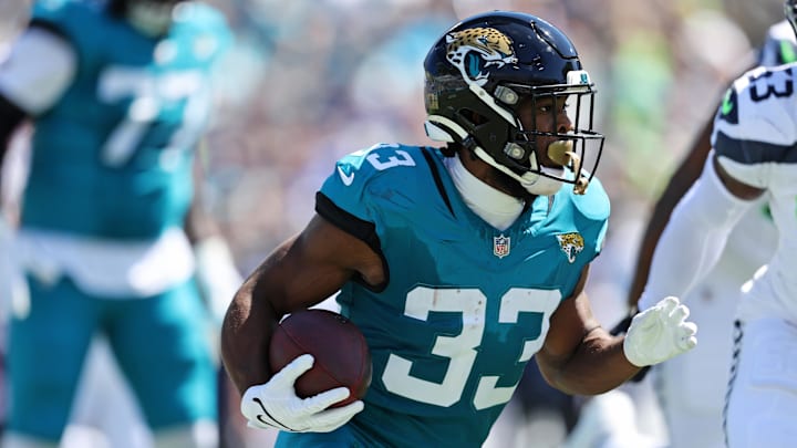 Oct 12, 2025; Jacksonville, Florida, USA; Jacksonville Jaguars running back Bhayshul Tuten (33) runs the ball during the first half against the Seattle Seahawks at EverBank Stadium. Mandatory Credit: Morgan Tencza-Imagn Images
