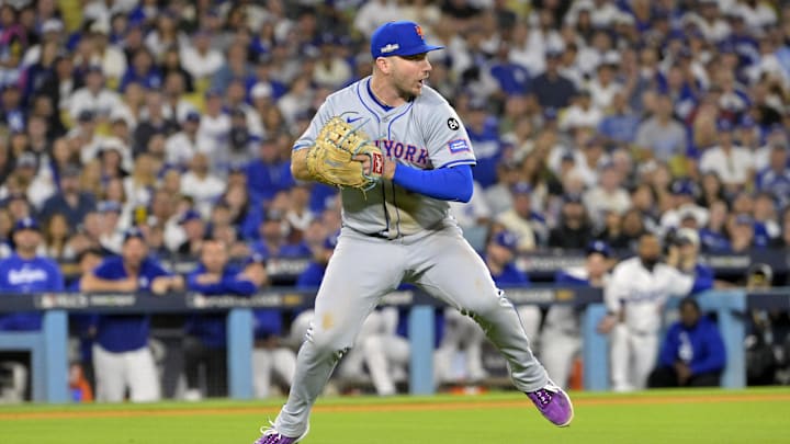 Oct 20, 2024; Los Angeles, California, USA; New York Mets first baseman Pete Alonso (20) fields the ball hit by Los Angeles Dodgers second baseman Chris Taylor (not pictured) in the sixth inning during game six of the NLCS for the 2024 MLB playoffs at Dodger Stadium. 