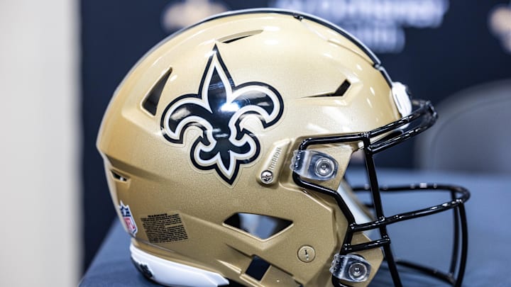 Mar 11, 2023; Metairie, LA, USA; Detailed view of New Orleans Saints helmet at Ochsner Sports Performance Center. Mandatory Credit: Stephen Lew-Imagn Images Mar 11, 2023; Metairie, LA, USA; Detailed view of New Orleans Saints helmet at Ochsner Sports Performance Center. Mandatory Credit: Stephen Lew-Imagn Images