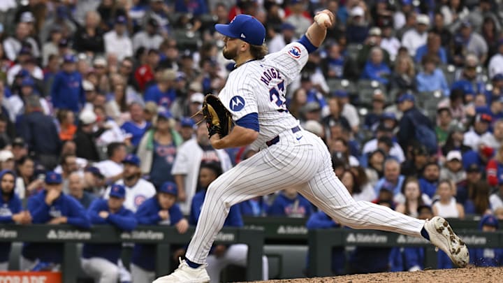 Sep 28, 2024; Chicago, Illinois, USA;  Chicago Cubs pitcher Porter Hodge (37) delivers against the Cincinnati Reds during the ninth inning at Wrigley Field. 